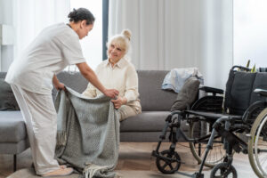 nurse taking care of senior woman at home